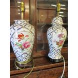 A pair of late 20th century Oriental style ceramic table lamps decorated with flora