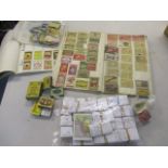 A collection of cigarette cards together with matchboxes and match box labels