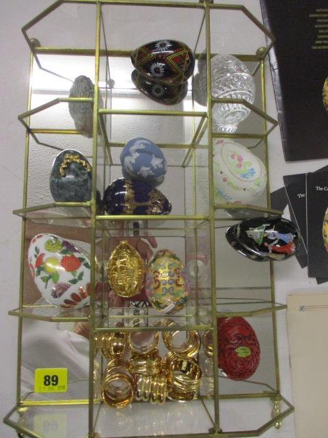 A collection of reproduction ornamental eggs with glass display stand and 'Collectors Treasury of - Image 5 of 5