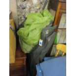 A Nash Norman Titian, Green fishing bivvy with poles and a carrying pack