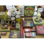 A quantity of vintage kitchenalia and food related tins to include Oxo, Marmite and Sanatogen tins