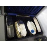 A silver brush set, boxed