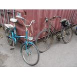 A vintage ladies bicycle with a dynamo and a 1966 Raleigh Pioneer bicycle