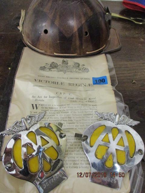 An Act for Inspection of Coal Mines paper, 1850, a coal miners helmet and two AA motorcar badges