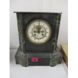 A Victorian marble cased mantle clock having a white enamel dial with Roman numerals and a visual