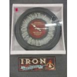 A reproduction oversized French wall clock, new and boxed, together with a reproduction metal 'Iron'