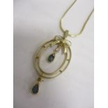 A blue zircon and diamond set necklace on a 9ct gold chain