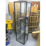 A modern black lacquered, tall glass display cabinet, 70 3/4" h x 19 1/2"w