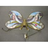 A butterfly hanging coloured glass light