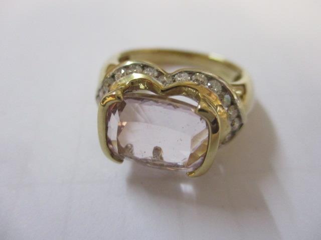 A Kunzite and diamond ring in 9ct gold