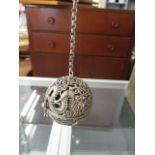 A modern silver plated hanging incense ball