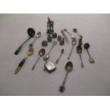A small selection of silver plate to include collectible spoons, lead figures and a silver vesta