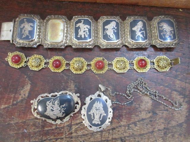 Siam silver jewellery to include a bracelet, a brooch and a pendant and a gilt filigree bracelet