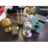 Mixed items to include a floating magnetic globe, an anniversary clock, a model of a ship, a