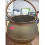 A coal scuttle in the form of a cauldron