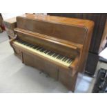 An upright Bentley piano, 43"h x 52 1/2"w