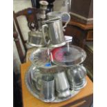 A large silver plated tray and cake stand, pewter tankards and mixed silver plate