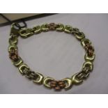 A 9ct tri-gold coloured bracelet, 10.9g