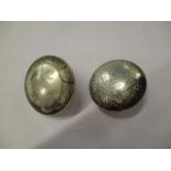 A pair of modern silver plated Chinese buttons