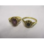 An 18ct gold sapphire set ring, together with a 9ct gold amethyst set ring