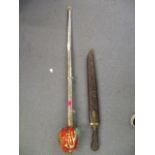 An East African sword with a carved, wooden scabbard, together with a Claymoor