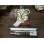 A Shaze sterling silver covered model of Geisha on a wooden plinth, 6"h and a silver handled