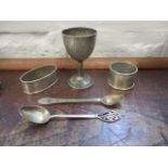 Chinese silver and white metal comprising two napkin rings, an egg cup and two spoons