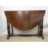 A Victorian rosewood Sutherland table with D Shaped, fall flaps, baluster turned columns and