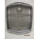 A Wolseley motorcar chrome radiator grill, with a badge, possibly from a 16/60, 22 1/2"h, 19"w