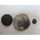 Three coins to include possibly a Lucinia silver Diobol 432-380 BC, possibly a Spanish colonial