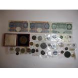 British coins and war issue banknotes to include half Crowns, a George III Farthing 1822, a