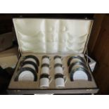 A boxed Royal Doulton 'Carlyle' set of coffee cans and saucers