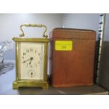 An early 20th century brass cased alarm carriage clock with travel case