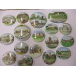 A collection of small enamelled lids to include Blenheim Palace and Ripon Cathedral scenes