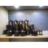 A black Wedgwood part coffee set with a piece of black Wedgwood Jasperware