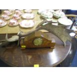 An Art Deco inlaid walnut cased mantle clock and a pair of antlers