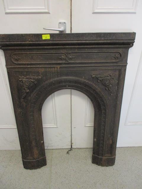 An early 20th century wrought iron fire surround