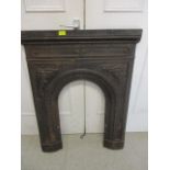 An early 20th century wrought iron fire surround