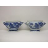 A pair of mid 18th century Chinese blue and white oval tureens with twin crossover handles on a