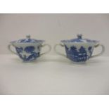 A pair of Pearlware blue and white custard cups, with domed covers and twin handles, decorated