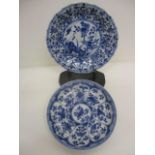 Two mid 18th century Chinese blue and white dishes, each decorated with panels of flowers and