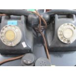 A vintage 5955 black telephone and one other, together with two handset parts