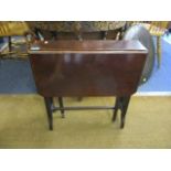 An Edwardian mahogany Sutherland table and a rosewood cased mantle clock