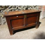 An 18th century oak panelled chest with internal candle tray