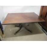 A regency brass string inlaid, rosewood breakfast table, the tip top having a bobbin turned edge