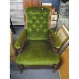 A Victorian mahogany green upholstered armchair, having spindle supports and standing on bulbous