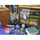 A cased microscope, balance scales and miscellaneous items to include a paperweight