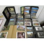 A group of fifteen postcard albums to include British and European postcards