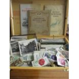 A quantity of vintage postcards to include Whitley Bay, cigarette cards to include Air Raid