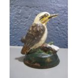 A painted cast iron door or window stop fashioned as a bird on a plinth, 3 3/4"h